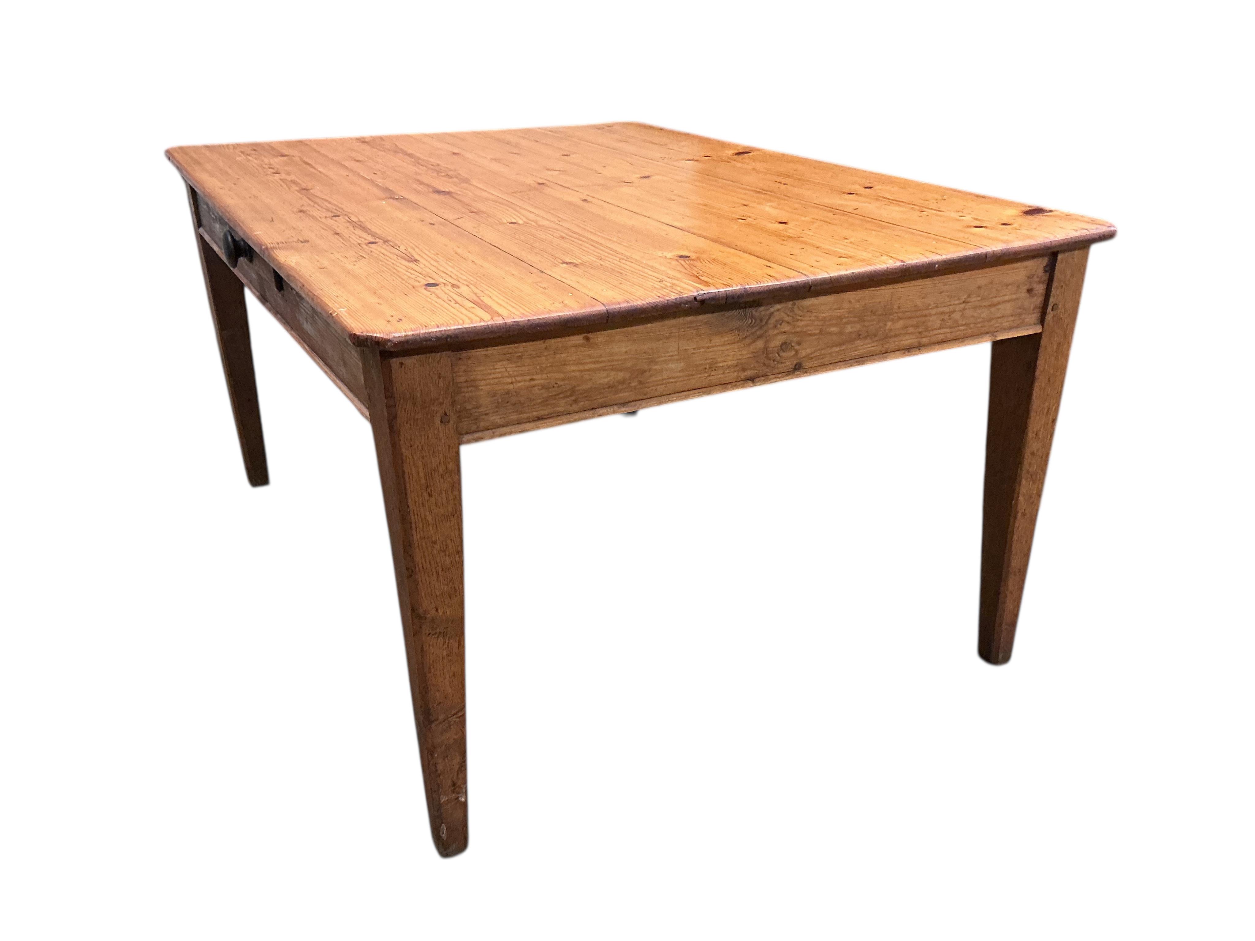 A mid 19th century rectangular pine kitchen table, fitted drawer on square tapered legs, width 136cm, depth 104cm, height 72cm